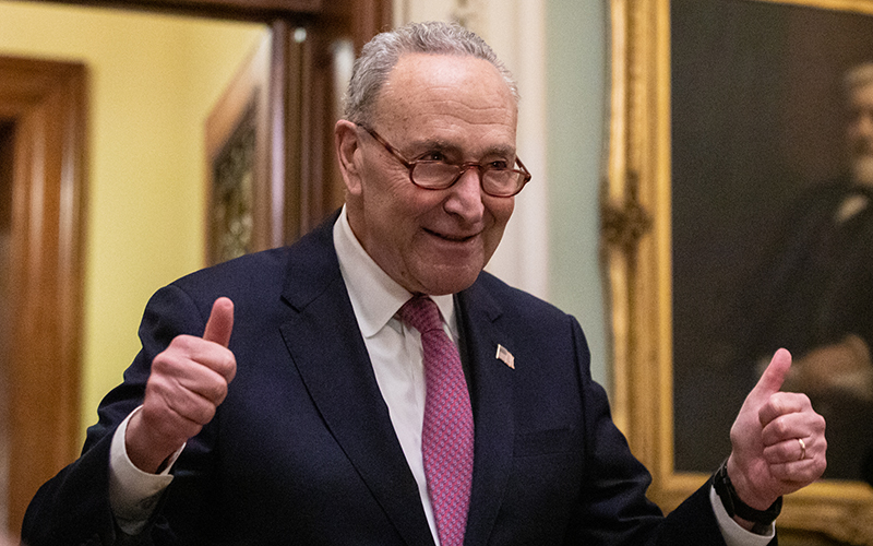 Senate Majority Leader Charles Schumer gives two thumbs up