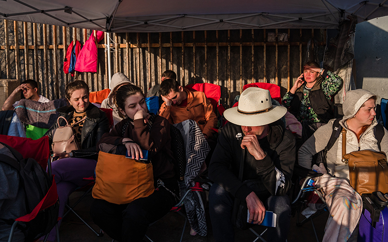 Refugees wait in line