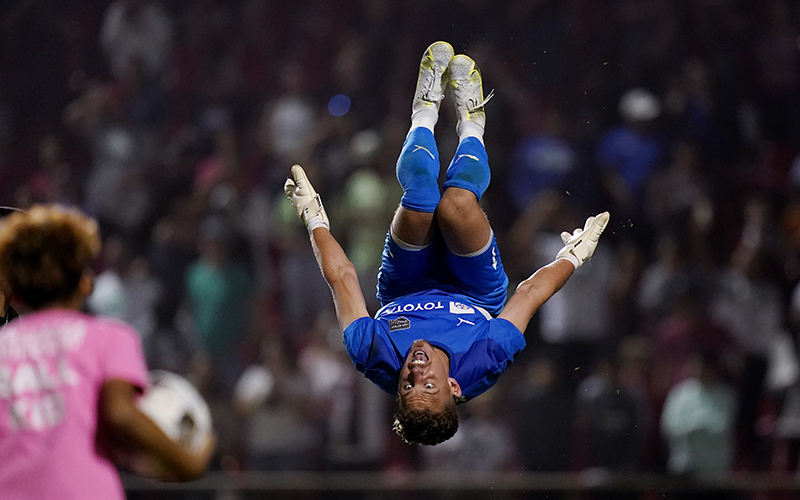 San Antonio FC goalkeeper Jordan Farr flips in the air