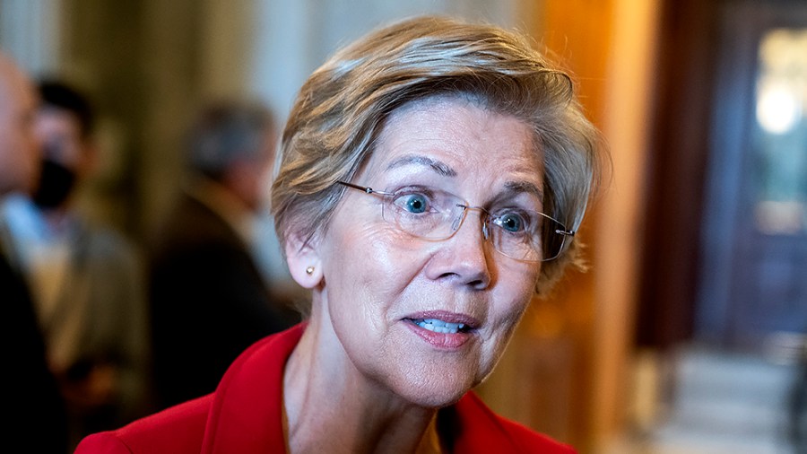 Sen. Elizabeth Warren (D-Mass.) speaks to reporters outside the Senate Chamber to discuss the nomination of Supreme Court nominee Ketanji Brown Jackson during procedural votes on Wednesday, April 6, 2022.