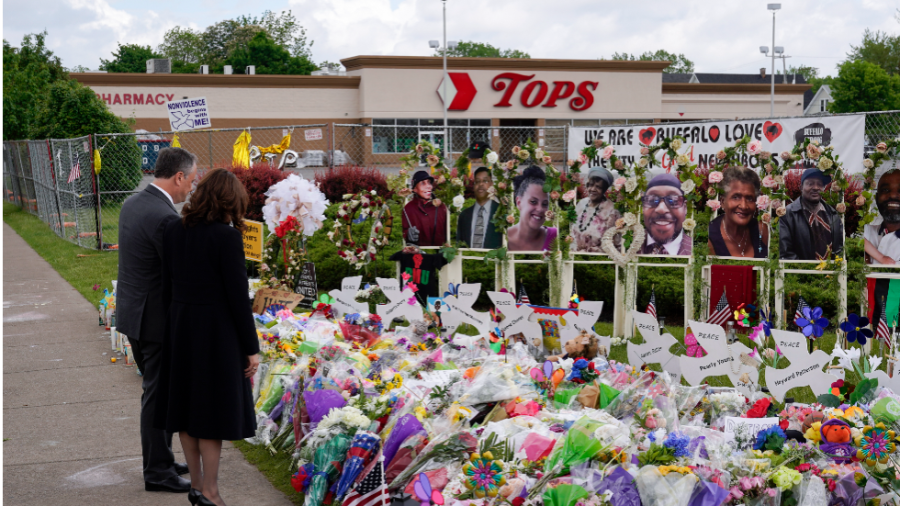 Vice President Kamala Harris and husband Doug Emhoff stand in front of a memorial at Tops Grocery Store in Buffalo, N.Y.