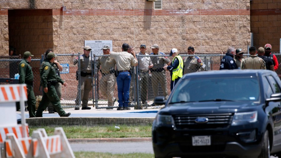 Law enforcement and other first responders gather outside Robb Elementary School in Uvalde, Texas.