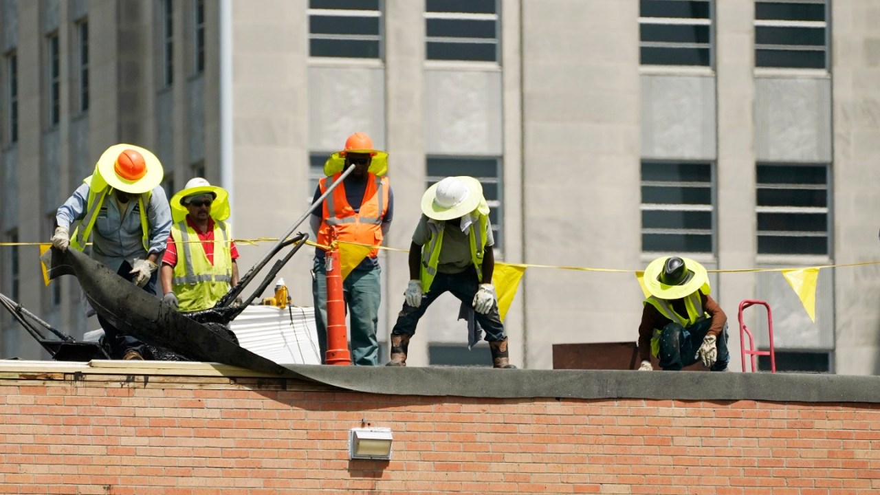 Workers on a roof.