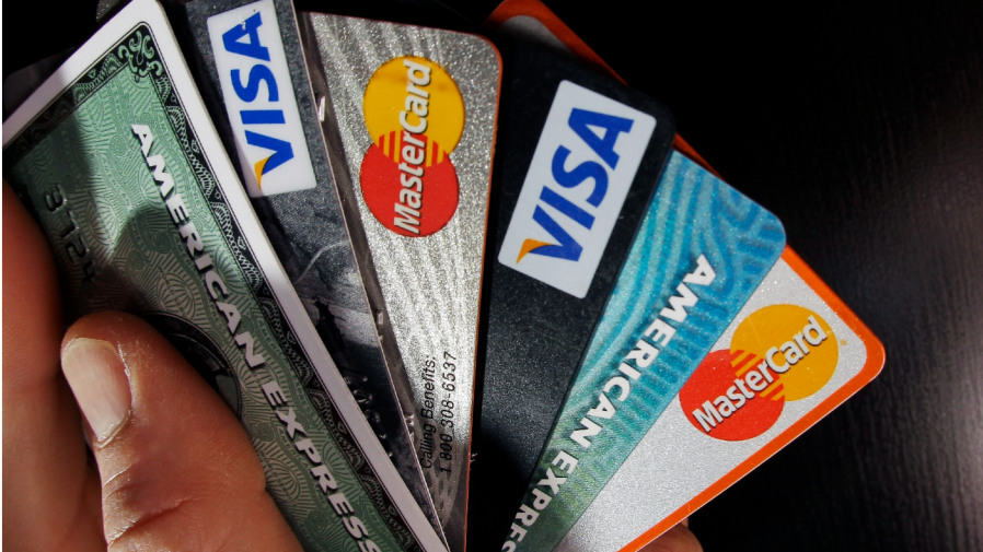 In this March 5, 2012, file photo, consumer credit cards are posed in North Andover, Mass.