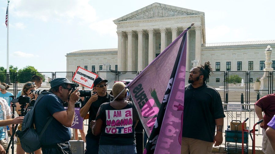 Protesters for and against abortion rights demonstrate outside the Supreme Court on Friday, June 24, 2022 in anticipation of an opinion that could strike Roe v. Wade.