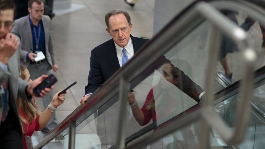 Sen. Pat Toomey (R-Pa.) walking towards the Senate Chamber for a vote regarding the Honoring our PACT Act on Wednesday, June 15, 2022.