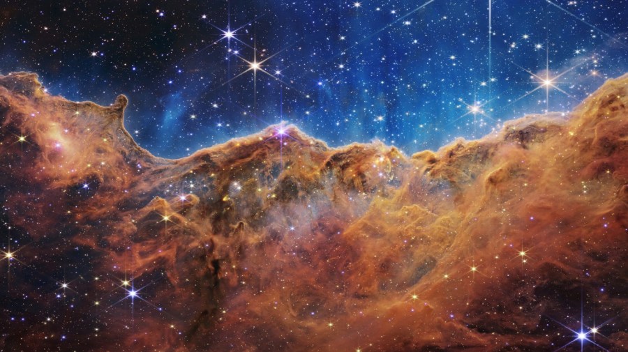 This image released by NASA on Tuesday, July 12, 2022, shows the edge of a nearby, young, star-forming region NGC 3324 in the Carina Nebula.