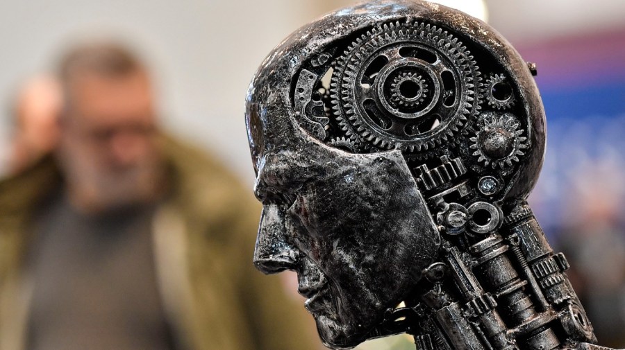 FILE - In this Nov. 29, 2019, file photo, a metal head made of motor parts symbolizes artificial intelligence, or AI, at the Essen Motor Show for tuning and motorsports in Essen, Germany.