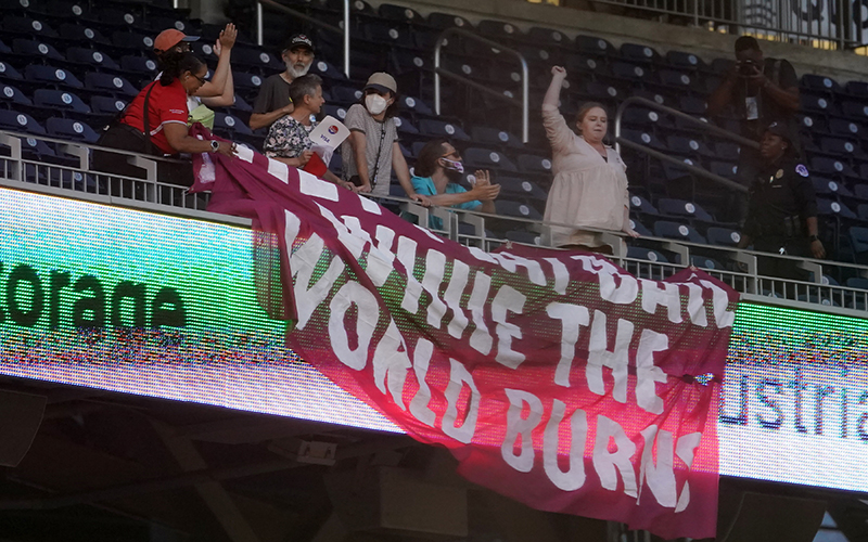 Climate protesters are seen during the Congressional Baseball Game