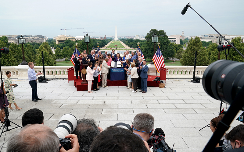 Speaker Nancy Pelosi (D-Calif.) signs the CHIPS and Science Act