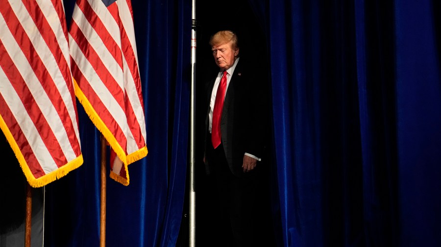 Former President Trump walks on stage during an event in Las Vegas.