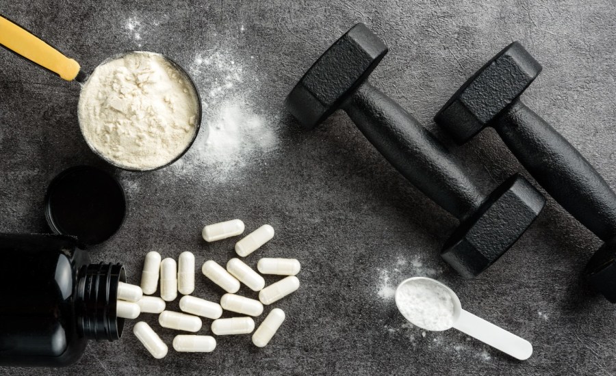 Fitness supplements next to weights.