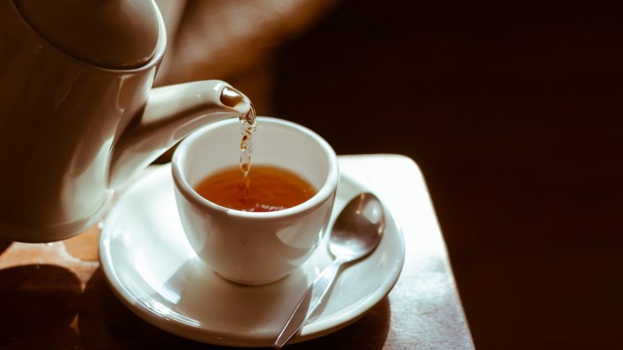 Tea being poured into a cup.