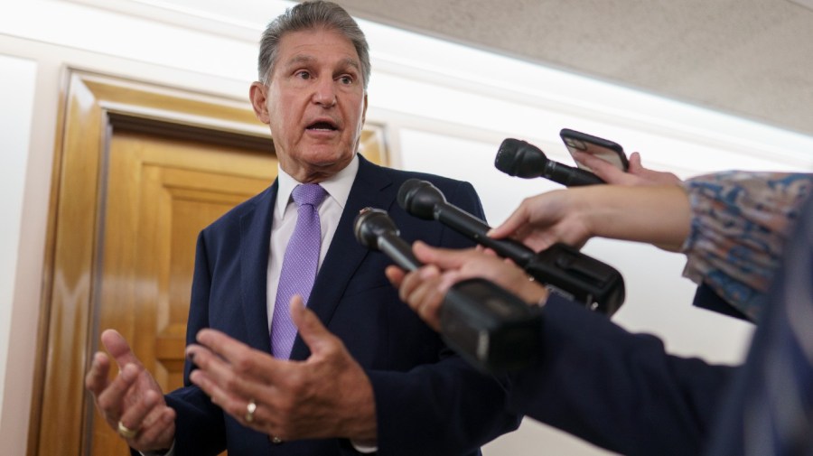 Sen. Joe Manchin, D-W.Va., talks with reporters on Capitol Hill in Washington, July 21, 2022.