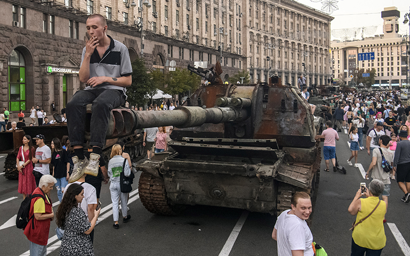 People look at destroyed Russian military equipment in Kyiv, Ukraine