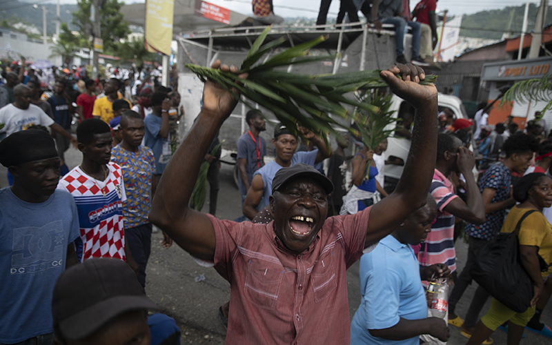 A demonstrator shouts during a protest to demand Haitian Prime Minister Ariel Henry step down