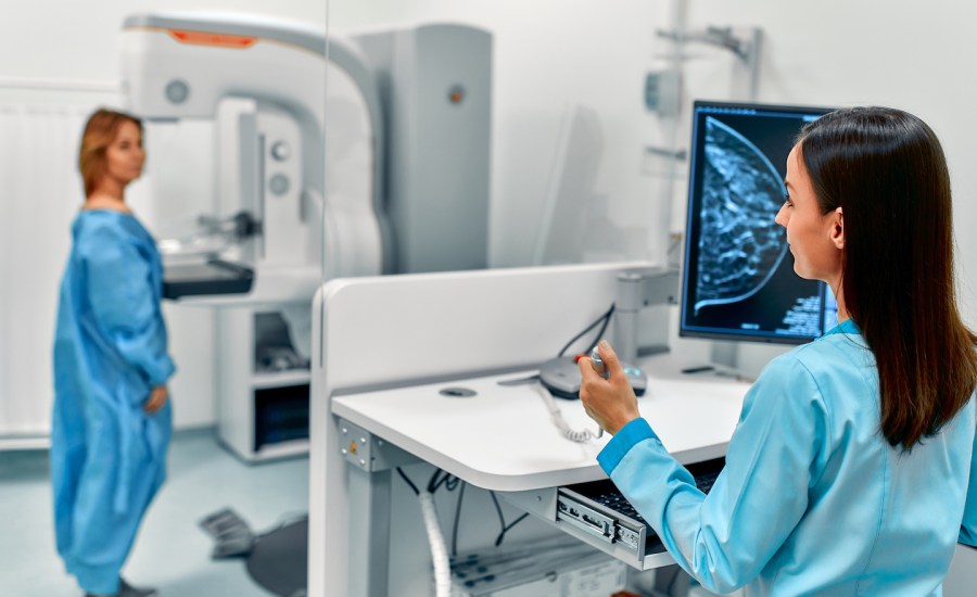 Nurse giving Mammogram.