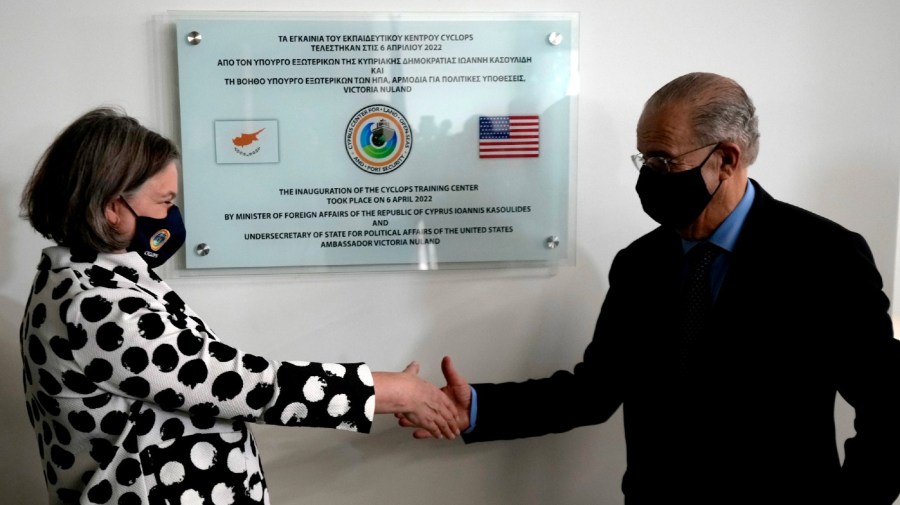 U.S. Under Secretary of State Victoria Nuland, left and Cypriot Foreign Affairs Minister Ioannis Kasoulides shake hands at the unveiling of CYCLOPS, in southeast port city of Larnaca, Cyprus, Wednesday, April 6, 2022.