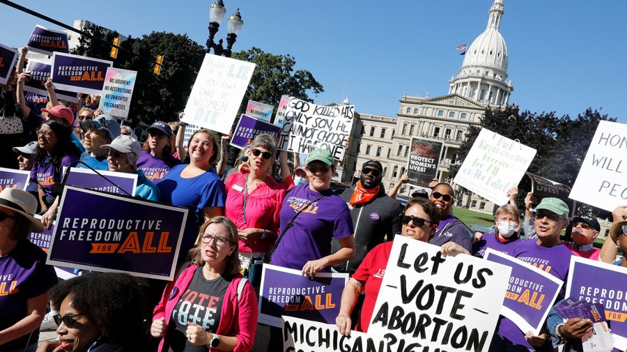 Abortion rights protesters gather outside the Michigan State Capitol