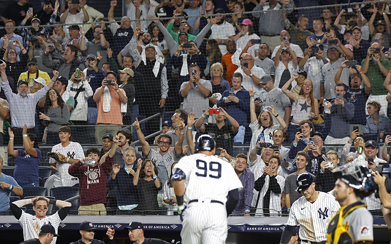 The crowd cheers after New York Yankees player Aaron Judge hit his 60th home run of the season