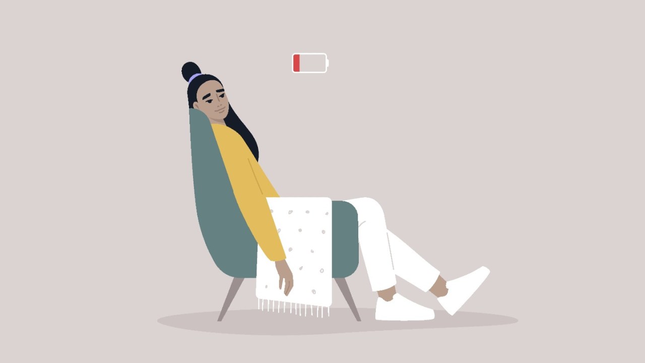 illustration of woman slouching in armchair, above her an energy bar down to red zone