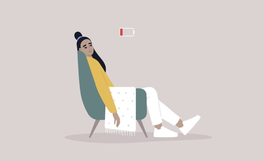 illustration of woman slouching in armchair, above her an energy bar down to red zone