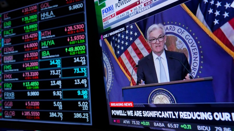 Traders work on the floor at the New York Stock Exchange as the Federal Reserve chairman Jerome Powell speaks after announcing a rate increase in New York, Wednesday, Nov. 2, 2022.