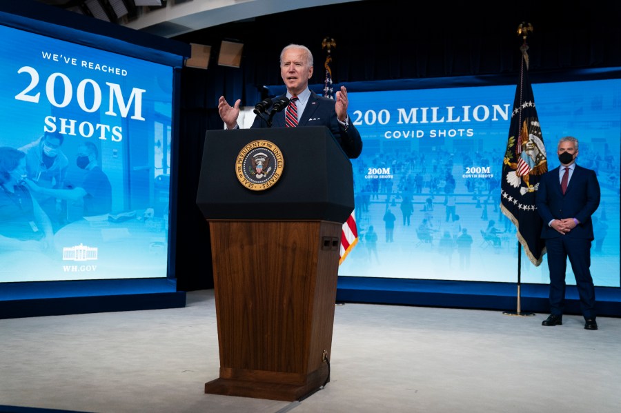 White House COVID-19 Response Coordinator Jeff Zients, right, listens as President Joe Biden speaks about COVID-19 vaccinations at the White House, Wednesday, April 21, 2021, in Washington. (AP Photo/Evan Vucci)