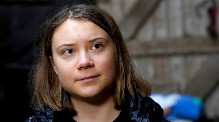 Greta Thunberg staring past camera