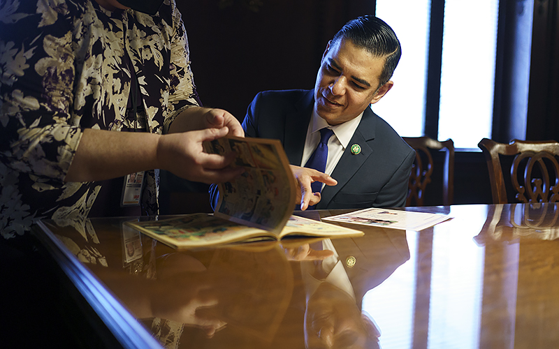 Rep. Robert Garcia (D-Calif.) views a copy of Superman #1 