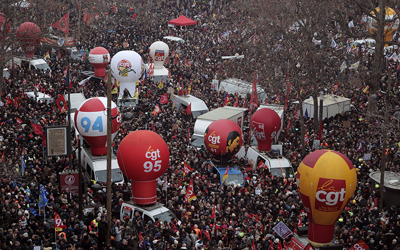 People gather on Place de la Republique during a demonstration against proposed pension changes