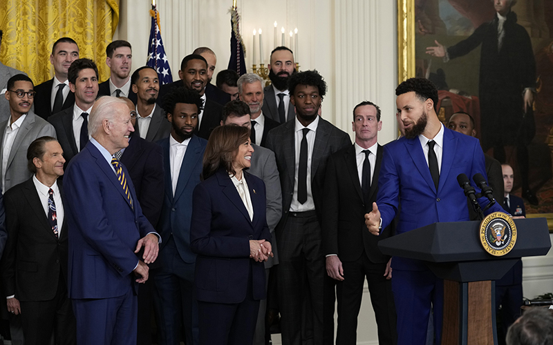 President Biden and Vice President Harris listen as NBA player Stephen Curry speaks