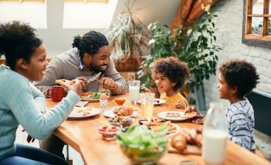 Family eating dinner together.