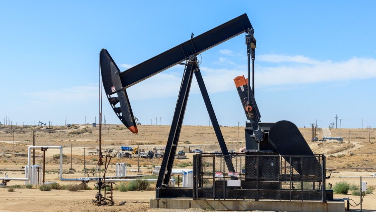Close up of a pumpjack in a oil field.