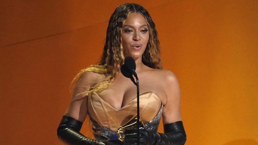 Beyonce accepts an award on stage.