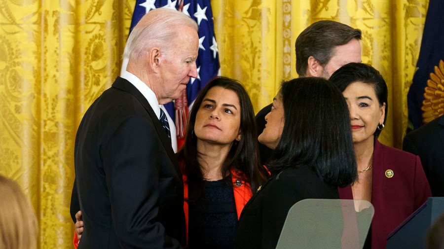 President Biden speaks with Reps. Nanette Barragan (D-Calif.) and Pramila Jayapal (D-Wash.)