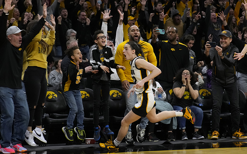 Iowa guard Caitlin Clark celebrates after making a 3-point basket