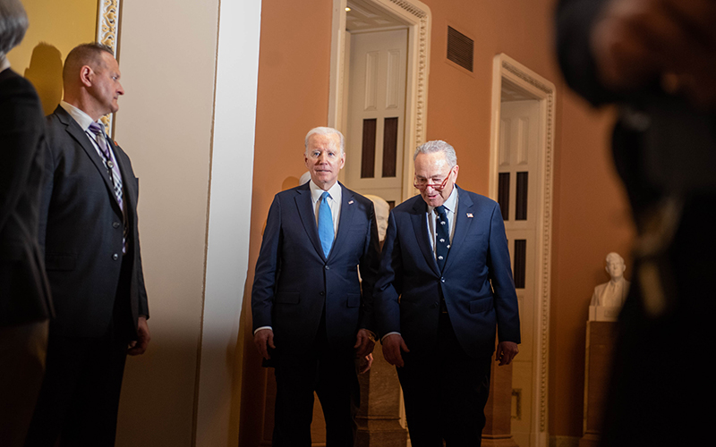 President Biden and Senate Majority Leader Chuck Schumer (D-N.Y.) leave a Senate Democratic Caucus luncheon