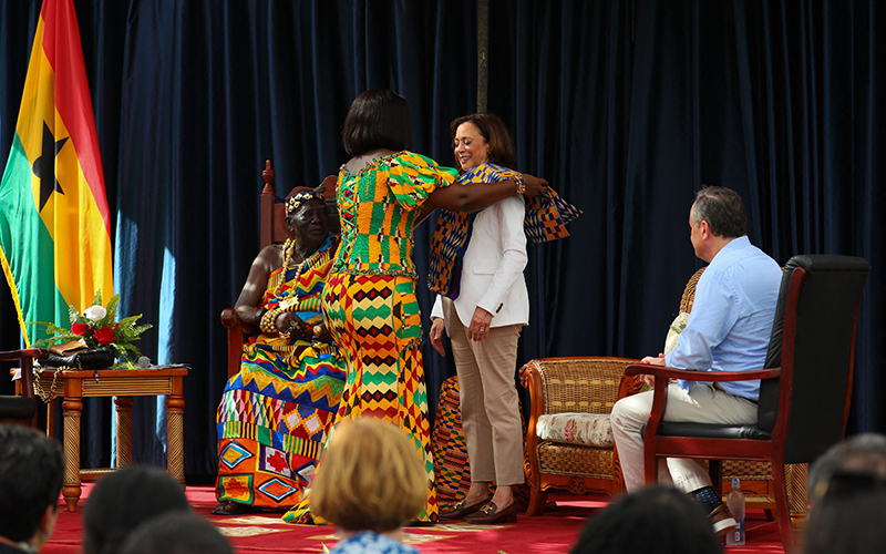 Vice President Harris receives a traditional Kente cloth at the Emintsimadze Palace in Cape Coast, Ghana