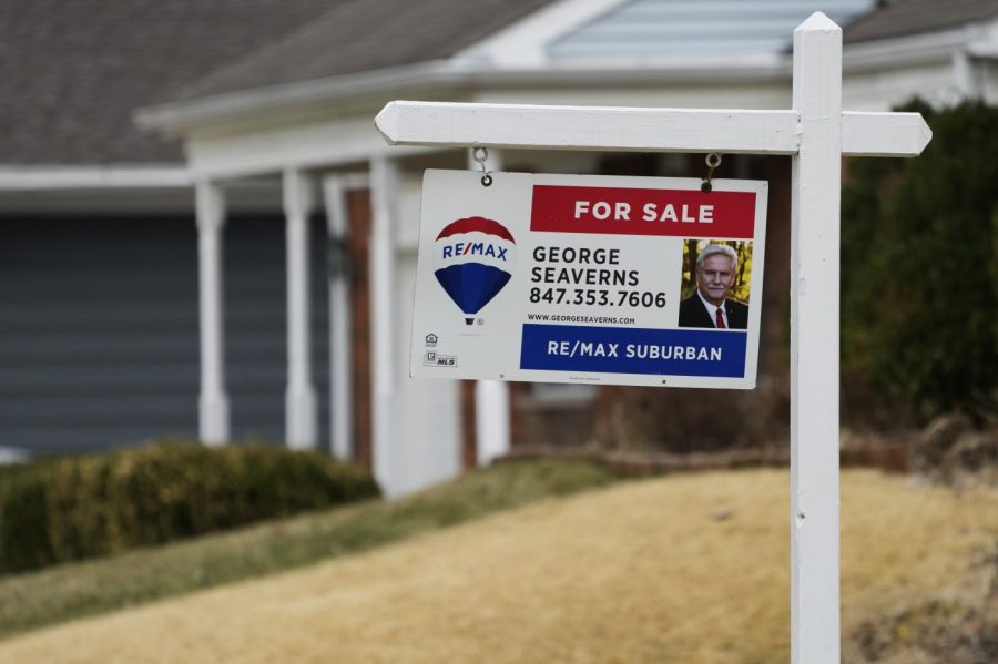 A "For Sale" sign stands near a housing lot in Buffalo Grove, Ill., Monday, March 20, 2023. On Thursday, Freddie Mac reports on this week’s average U.S. mortgage rates. (AP Photo/Nam Y. Huh)