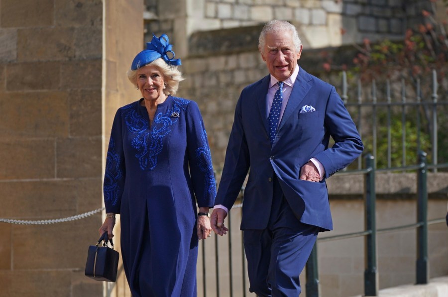 FILE - Britain's King Charles III and Camilla, the Queen Consort attend the Easter Mattins Service at St George's Chapel at Windsor Castle in Windsor, England, Sunday April 9, 2023. King Charles III will be taking a short cut and a smoother ride to Westminster Abbey on May 6, 2023, trimming the procession route his mother took in 1953 as he aims for a more modest coronation that will include some modern touches. (Yui Mok/Pool via AP, File)