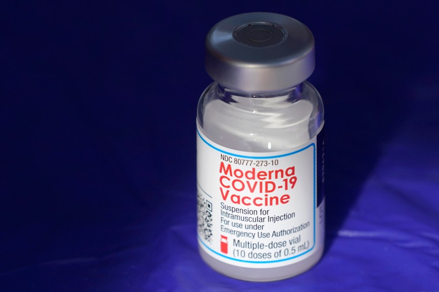 FILE - In this March 4, 2021 file photo, a vial of the Moderna COVID-19 vaccine rests on a table at a drive-up mass vaccination site in Puyallup, Wash., south of Seattle. Moderna shares slipped Tuesday, April 11, 2023, after the COVID-19 vaccine developer said its potential flu vaccine needs more study in a late-stage clinical trial. (AP Photo/Ted S. Warren, File)