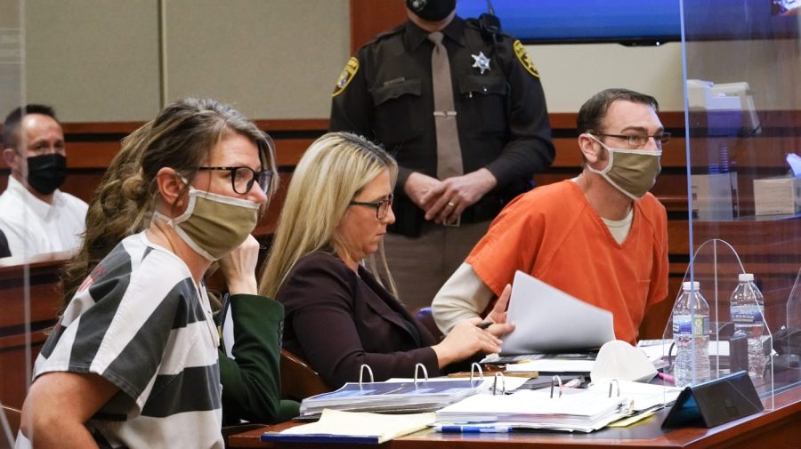 FILE - Jennifer Crumbley, left, and James Crumbley, right, the parents of Ethan Crumbley, a teenager accused of killing four students in a shooting at Oxford High School in Oxford, Mich., appear in court for a preliminary examination on involuntary manslaughter charges in Rochester Hills, Mich., Feb. 8, 2022. Criminal investigations of parents and school employees are rare following a school shooting, experts say. But they appear to be gaining traction as communities demand accountability and new ways to prevent the violence. (AP Photo/Paul Sancya, File)