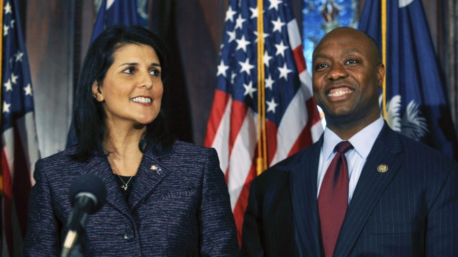 FILE - South Carolina Gov. Nikki Haley, left, announces Rep. Tim Scott, right, as Sen. Jim DeMint's replacement in the U.S. Senate during a news conference at the South Carolina Statehouse, Dec. 17, 2012, in Columbia, S.C. (AP Photo/Rainier Ehrhardt, File)