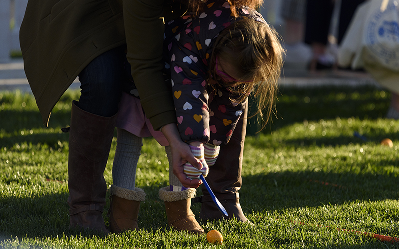 A child participates in the annual White House Easter Egg Roll