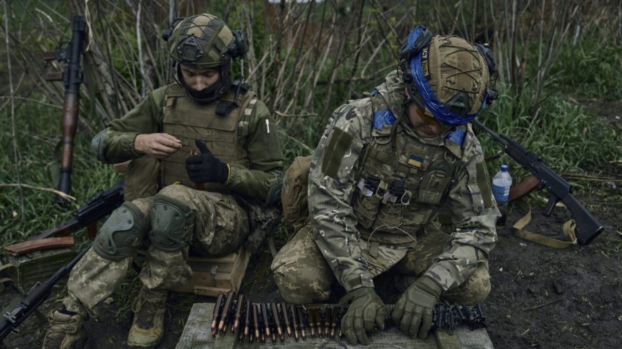 Ukrainian soldiers prepare their ammunition at the frontline positions near Vuhledar, Donetsk region, Ukraine, Monday, May 1, 2023. (AP Photo/Libkos)