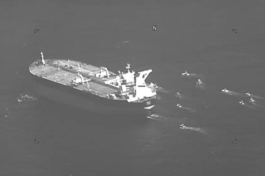 This still image from video released by the U.S. Navy shows the Panama-flagged oil tanker Niovi surrounded by Iranian Revolutionary Guard vessels in the Strait of Hormuz Wednesday, May 3, 2023.