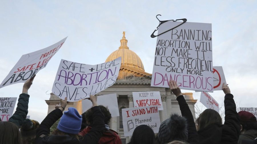 FILE - Demonstrators protest outside the state Capitol in Madison, Wis., on May 3, 2022, in response to the news that the U.S. Supreme Court could be poised to overturn the landmark Roe v. Wade case that legalized abortion nationwide. A Wisconsin judge is set to consider Thursday, May 4, 2023, whether the state's attorney general can legally challenge the battleground state's 174-year-old abortion ban and whether the ban is so old its unenforceable. (Amber Arnold/Wisconsin State Journal via AP, File)