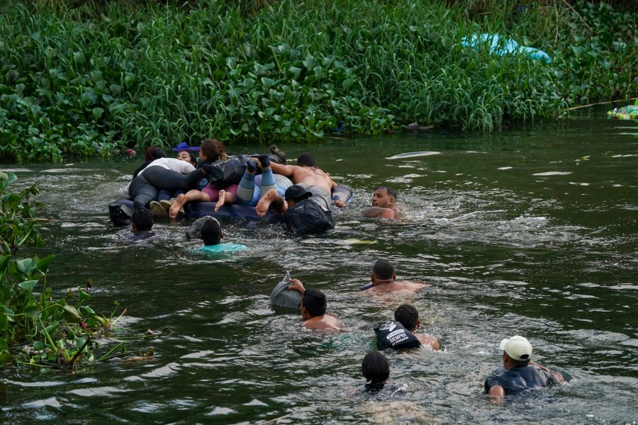 Migrants cross the Rio Bravo into the United States from Matamoros, Mexico, Tuesday, May 9, 2023. The U.S. is preparing for the Thursday, May 11th end of the Title 42 policy, linked to the coronavirus pandemic that allowed it to quickly expel many migrants seeking asylum. (AP Photo/Fernando Llano)