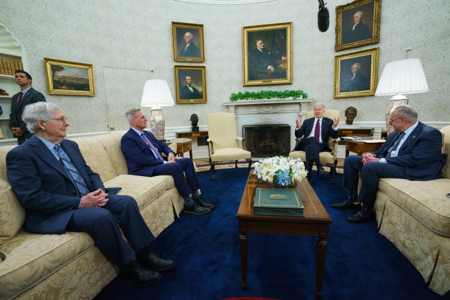 FILE - Senate Minority Leader Mitch McConnell of Ky., Speaker of the House Kevin McCarthy of Calif., and Senate Majority Leader Sen. Chuck Schumer of N.Y., listen as President Joe Biden speaks before a meeting to discuss the debt limit in the Oval Office of the White House, Tuesday, May 9, 2023, in Washington. (AP Photo/Evan Vucci, File)